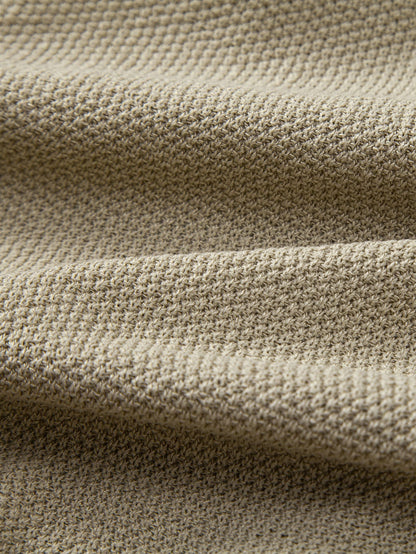 Polo de punto con cremallera texturizada