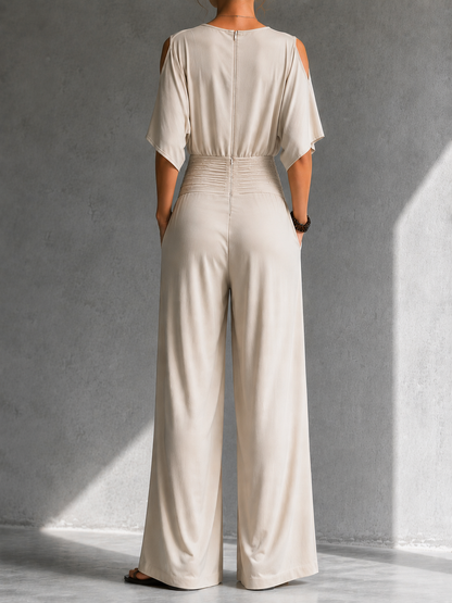 Mono elegante mujer con escote cruzado y cintura fruncida