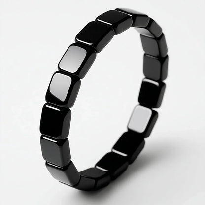 Detalle de pulsera de hematita negra masculina Hora Paris
