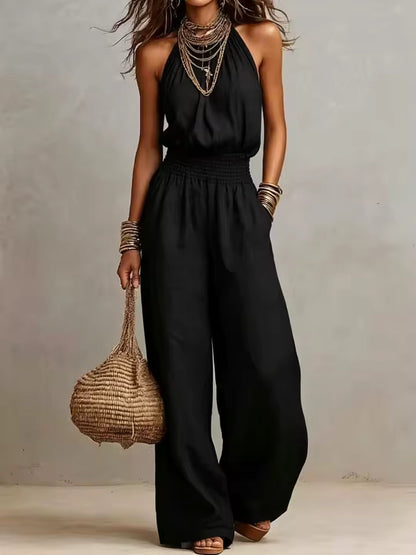 Mono mujer de espalda descubierta con escote halter y pierna ancha