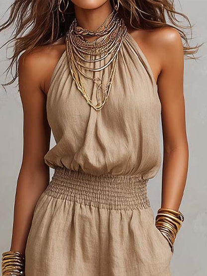 Mono mujer de espalda descubierta con escote halter y pierna ancha